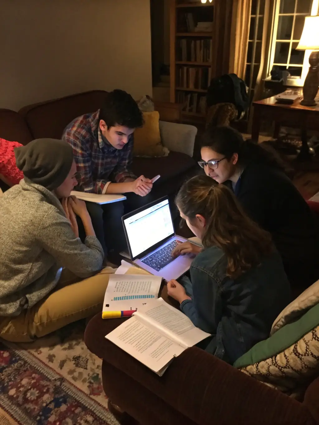 A collaborative coding session with students working together on a project, sharing ideas and solutions.